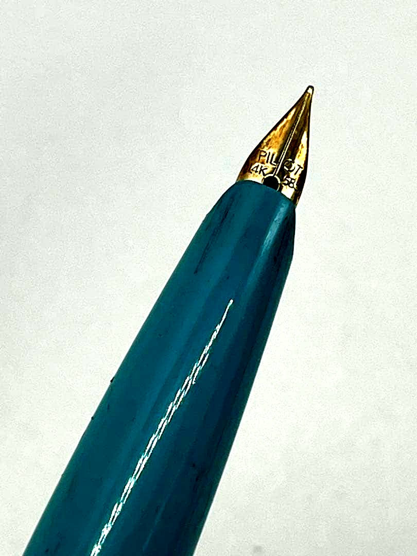 Pilot fountain pen with 14K gold-plated fine nib in turquoise blue and silver etching design