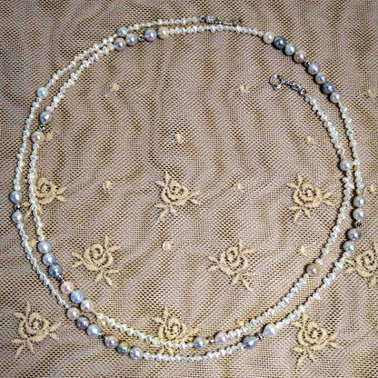 Long necklace with 2.5-3.5mm Akoya Keshi pearls and 5mm natural color Akoya baroque pearls on silver925 chain