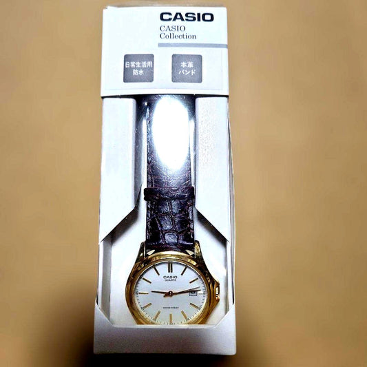 Casio MTP-1183Q-7AJH quartz wristwatch with white dial and silver-tone case and strap