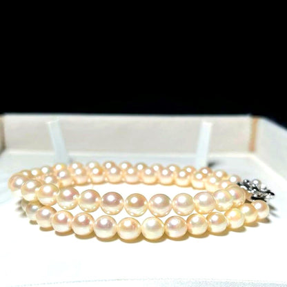 Akoya pearl necklace with 6.5-7.0mm round white pearls on a 42.5cm silver chain stamped SILVER