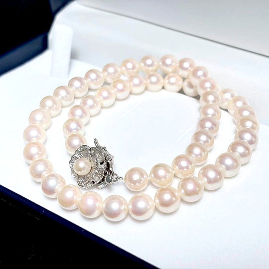 Honka Pearl Akoya necklace with 8.0-8.5mm white pearls and silver clasp on a white background