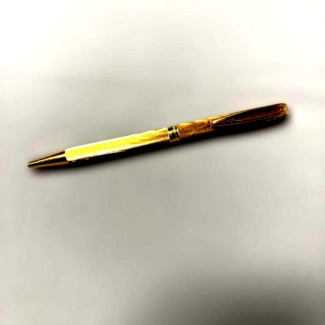 Waterman gold color ballpoint pen with sleek design and smooth finish