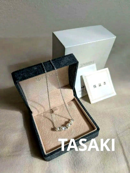 Tasaki Baby Pearl Silver Necklace with white baby pearls, adjustable 200mm length, displayed with certificate and box