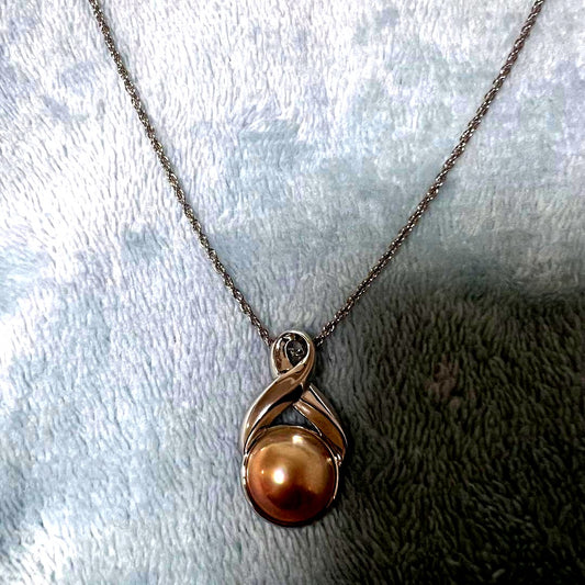 Tasaki Pearl Necklace with curved design and solid Mabe pearl pendant on engraved clasp closure