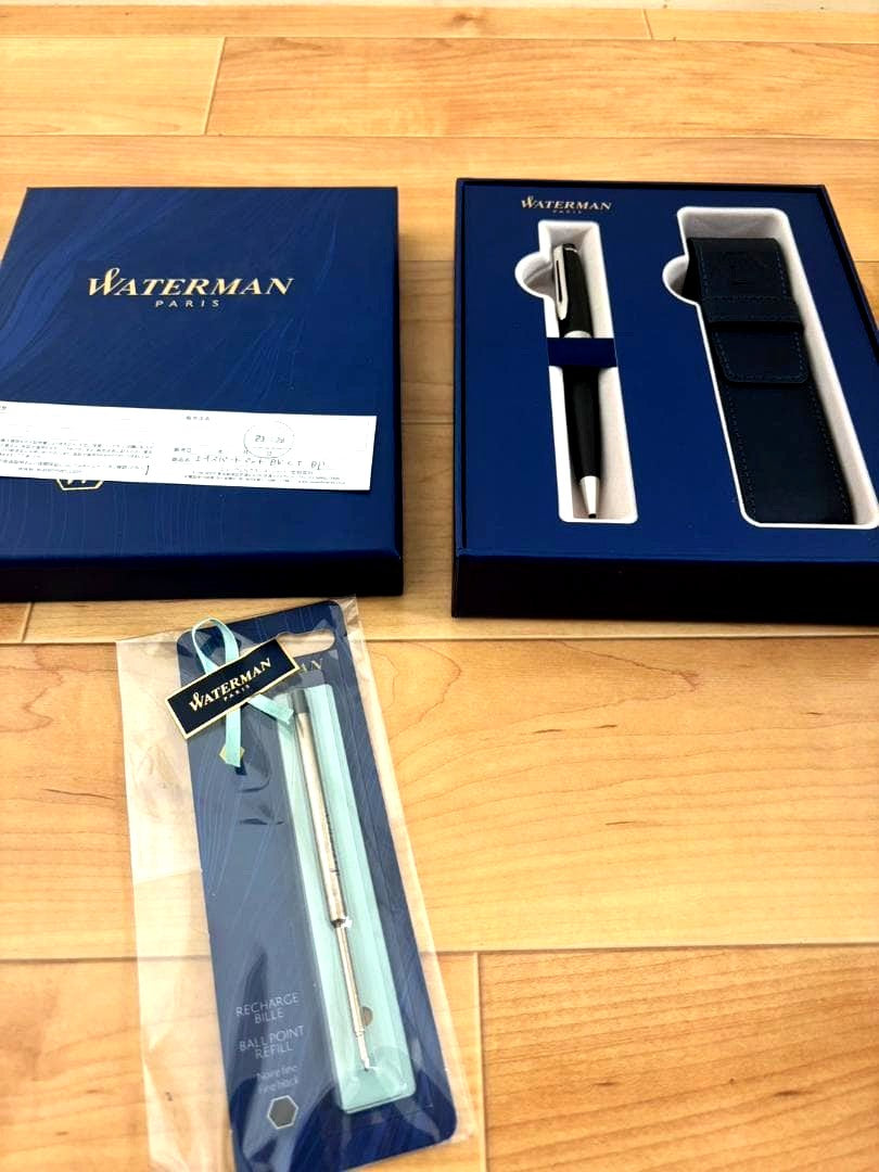 Waterman ballpoint pen with gold accents and included paper bag and accessories from 2023