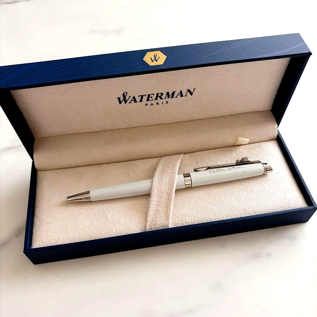 Waterman and Hello Kitty ballpoint pen with metal body and colorful design on white background