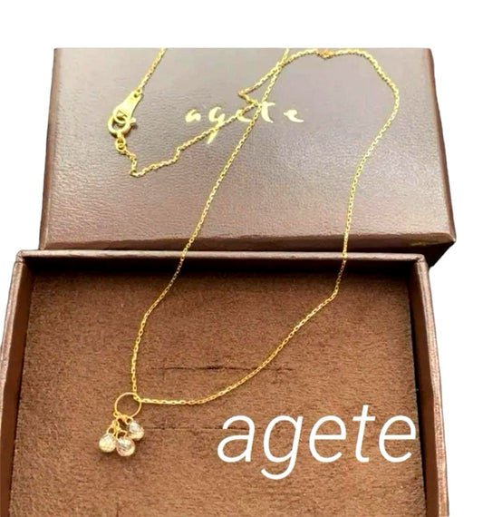 Aget Necklace featuring a finely cut brown diamond set in K18 gold with a delicate shine