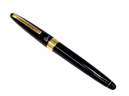 Pilot fountain pen with 18K gold nib and black metal body, decorated with gold accents