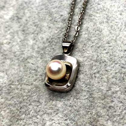 Akoya pearl necklace with 6.3mm white pearls and silver mark pendant on 41cm chain