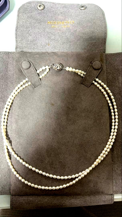 MIKIMOTO Baby Pearl Necklace with white freshwater pearls in new condition displayed with aged case