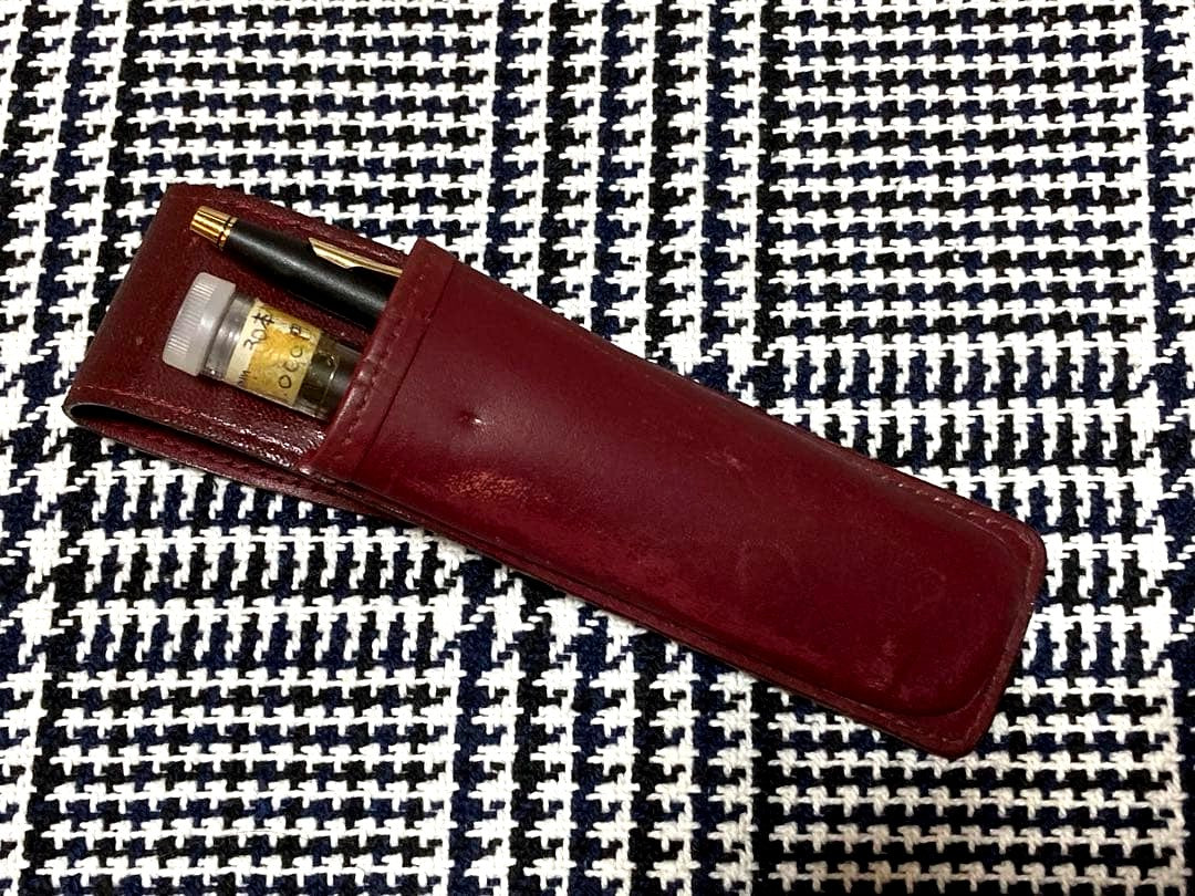 Cross mechanical pencil with wine-colored pen holder and 23 lead refills displayed