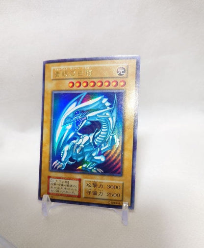 Yugioh Blue-Eyes White Dragon Early Ultra Rare trading card in protective sleeve and hard case