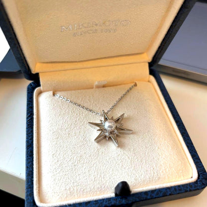 Mikimoto Star Necklace with a pearl pendant and star design on a silver chain