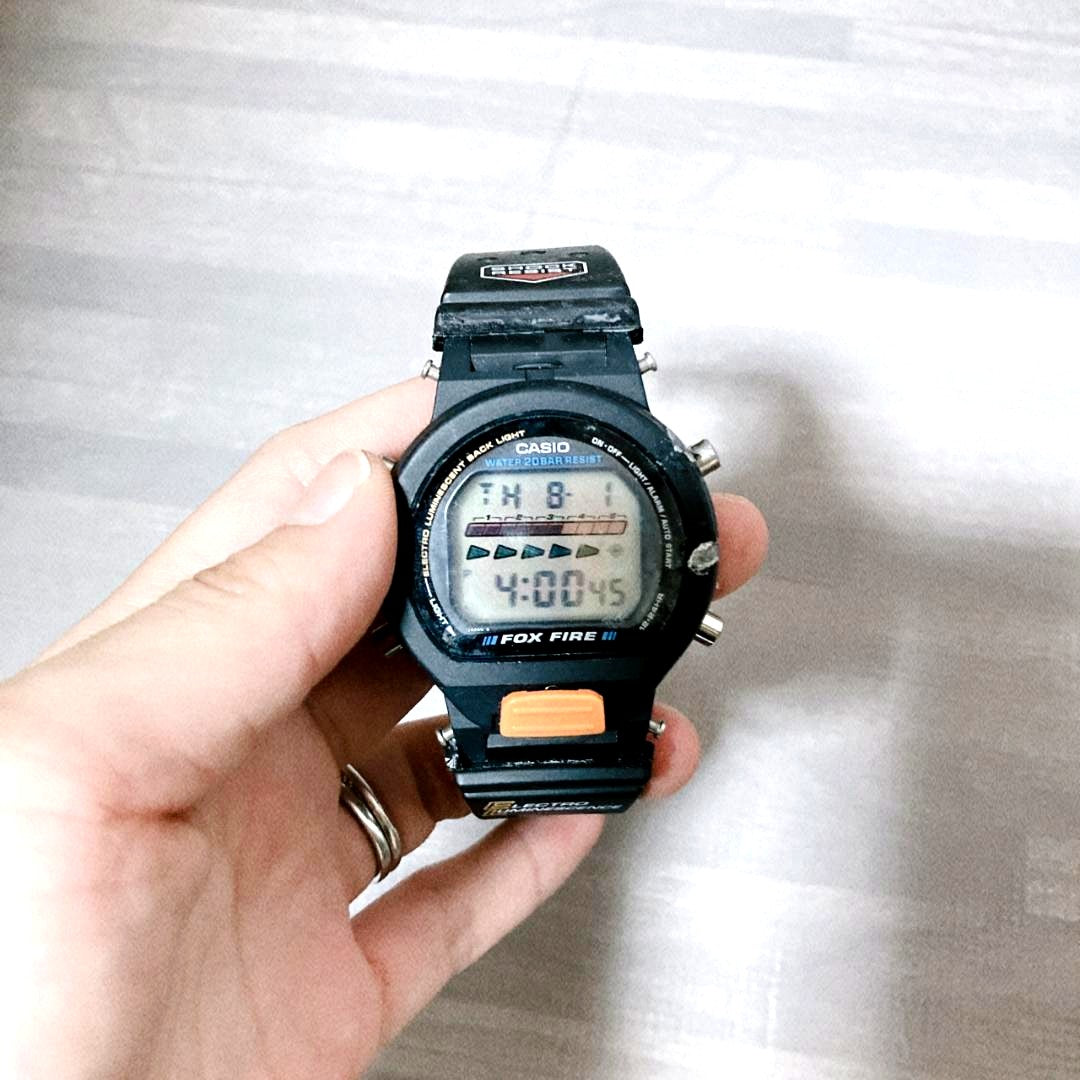Casio Fox Fire G-SHOCK DW-6600B digital watch with black silicone band and orange digital display