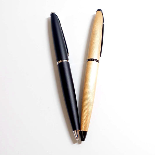 Two Cross ATX ballpoint pens model T1362 with visible wear and no ink