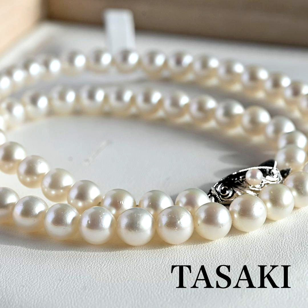 Tasaki Akoya Pearl Necklace featuring 7mm round pearls and a silver clasp on a white background