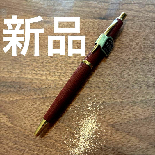 New PILOT high-end ballpoint pen with brown leather-like body and gold accents, fine point tip, black ink