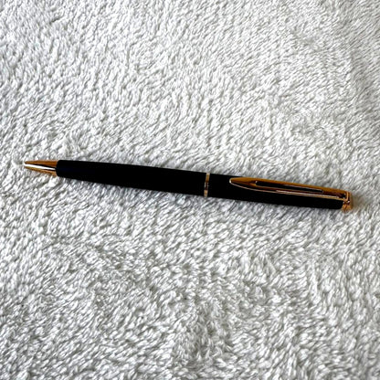 Black Waterman Paris ballpoint pen with included case shown on a white background