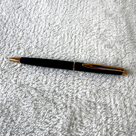 Black Waterman Paris ballpoint pen with included case shown on a white background