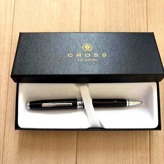 Casio Cross black ballpoint pen with plain body, used condition, no box or papers included