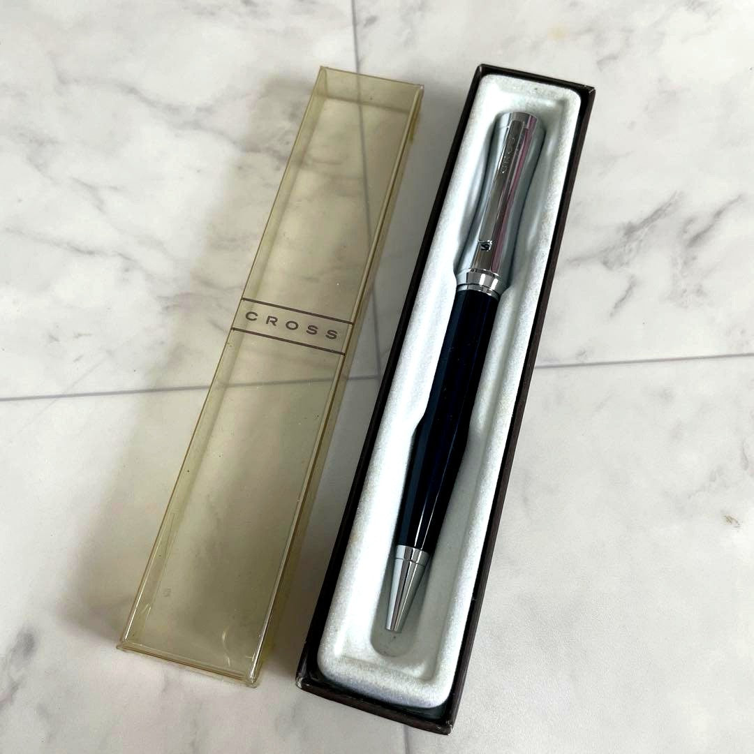 Cross brand vintage ballpoint pen with yellowed case and black ink tested, unused interior