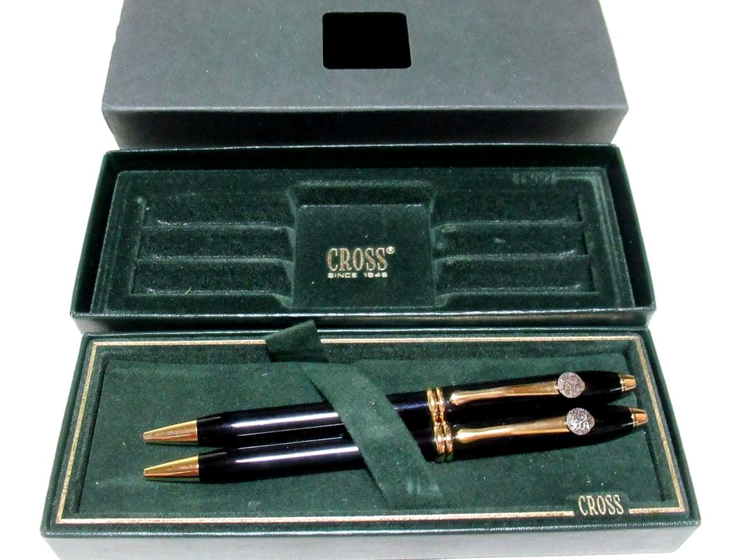 Two Merrill Lynch Cross Townsend black ballpoint pens from 1980s with logos and original box