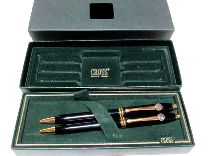 Two Merrill Lynch Cross Townsend black ballpoint pens from 1980s with logos and original box