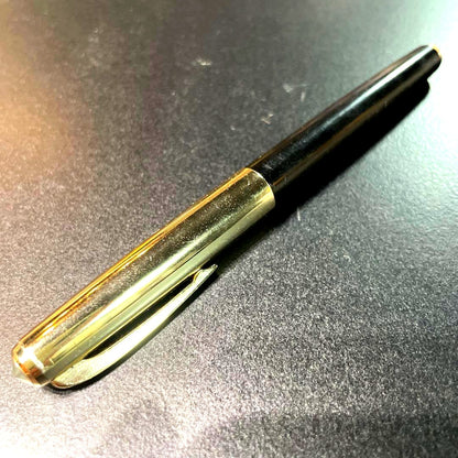 Pilot fountain pen with black and gold body featuring HK K14 engraving