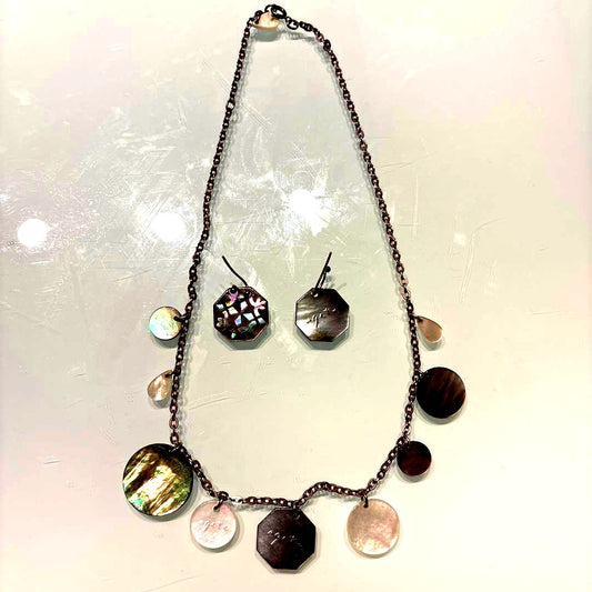 Agete necklace with chain and shell charm paired with hook earrings featuring an octagonal motif and storage pouch