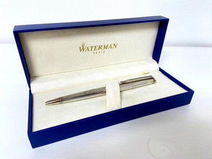 Waterman ballpoint pen with blue ink metal body, box, and instruction manual, lightly used condition