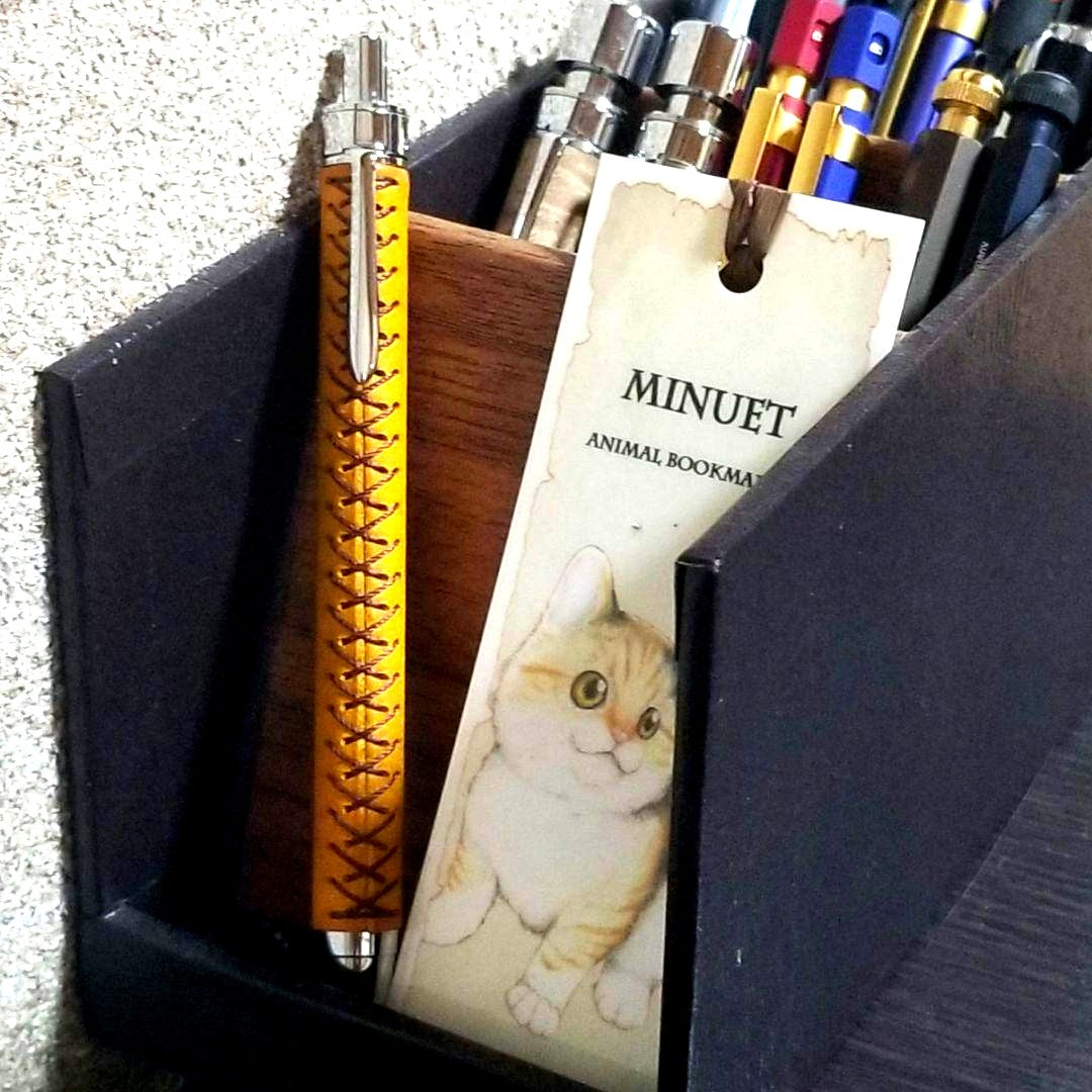 Katsuyama Leather Pencil Sharpener No.02 with sunflower-colored leather and 0.5mm mechanical pencil lead