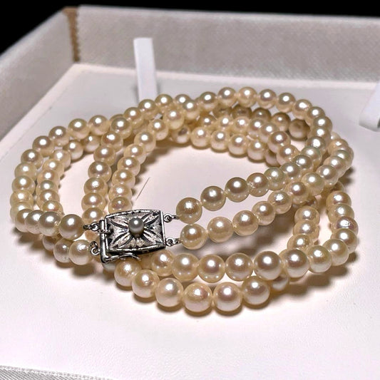 Two-row Akoya pearl necklace with 5.5-6.0mm round white pearls on silver chain model O606