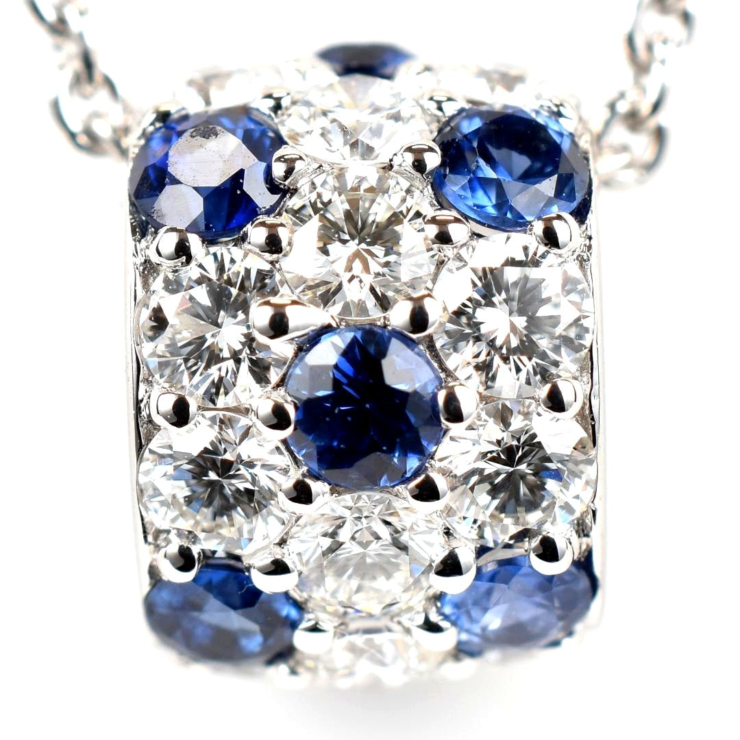 Newly restored Mikimoto white gold necklace with sapphire and diamond pendant measuring 39 cm length