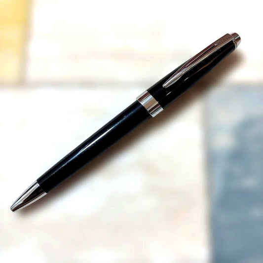 CROSS ballpoint pen with glossy black body and silver accents shown on white background