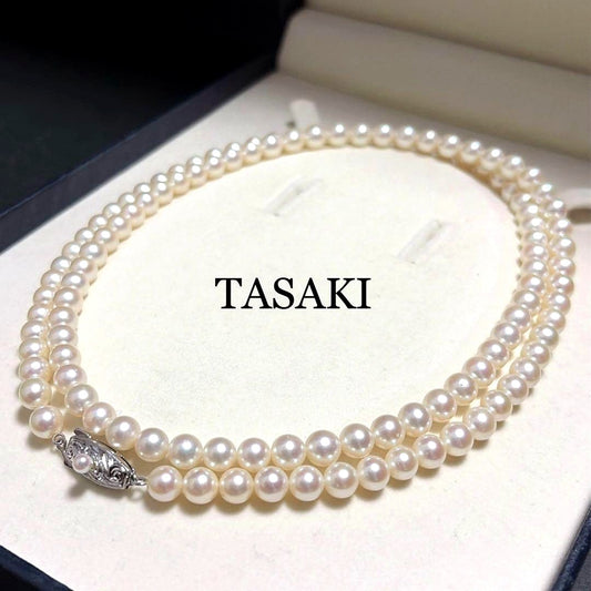 Tasaki Akoya pearl long necklace with 6.5mm genuine pearls and high luster on a white background