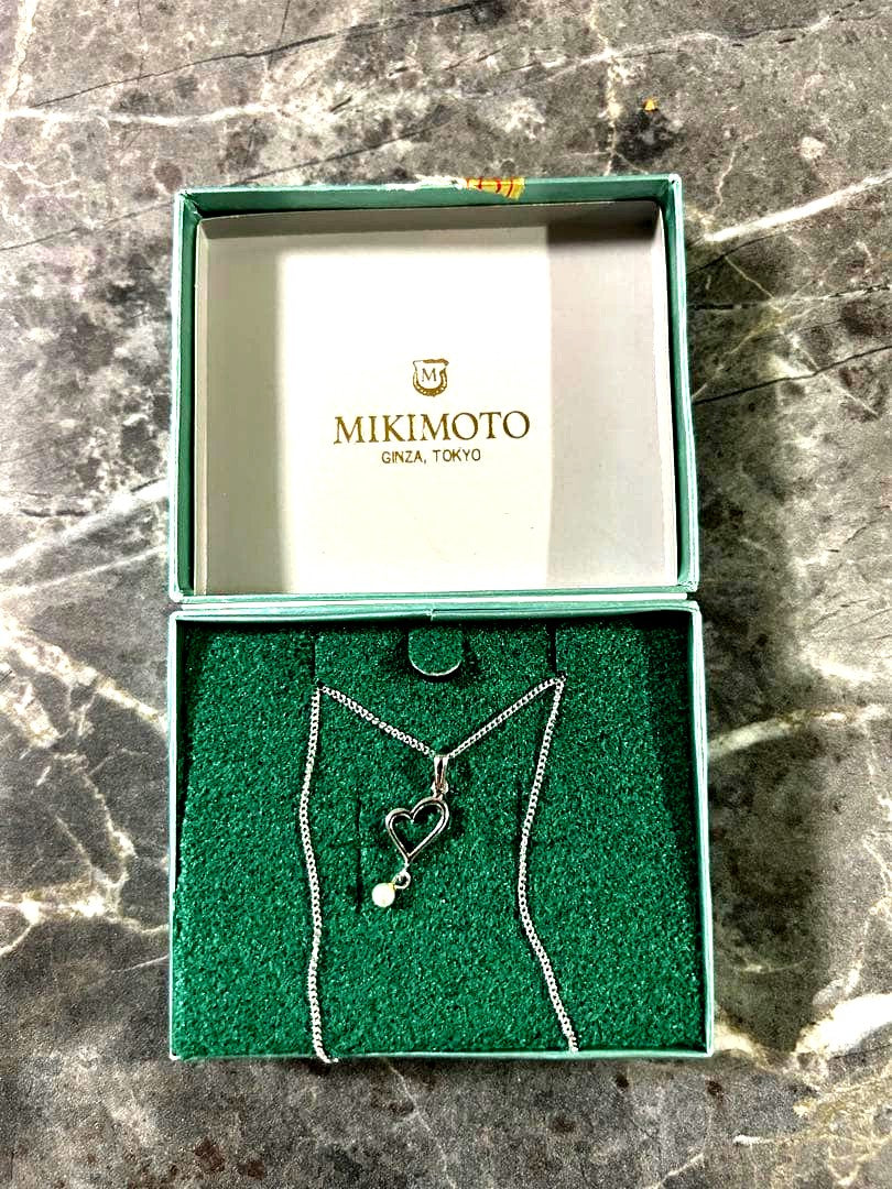 MIKIMOTO heart-shaped necklace featuring lustrous pearls on a delicate chain