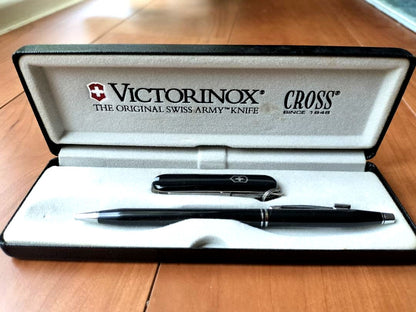 Victorinox Cross Collaboration set with black ballpoint pen and Swiss Army knife displayed on white background