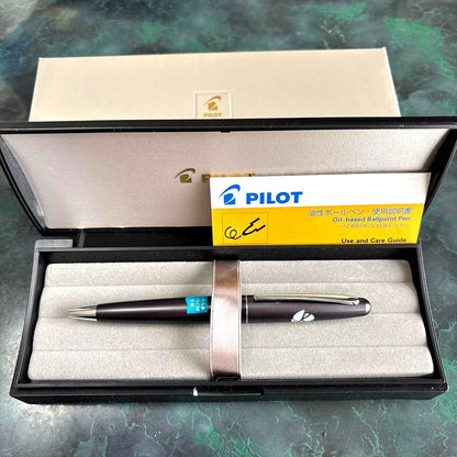 PILOT Cocoon oil-based ballpoint pen in gray with logo displayed with case