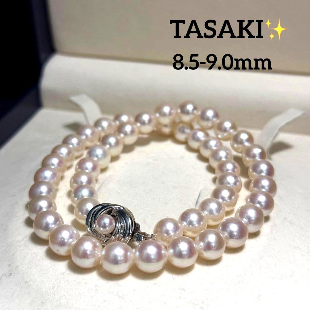 Tasaki Akoya pearl necklace with 9.0 mm pink pearls and silver closure on a white background