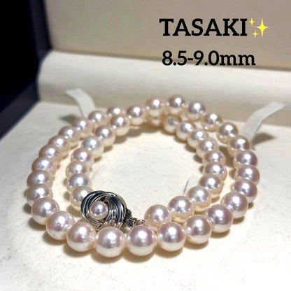 Tasaki Akoya pearl necklace with 9.0 mm pink pearls and silver closure on a white background
