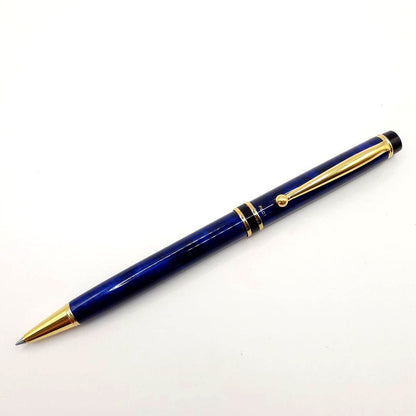 Used Pilot ballpoint pen in blue marble pattern with visible small scratches and paint chips