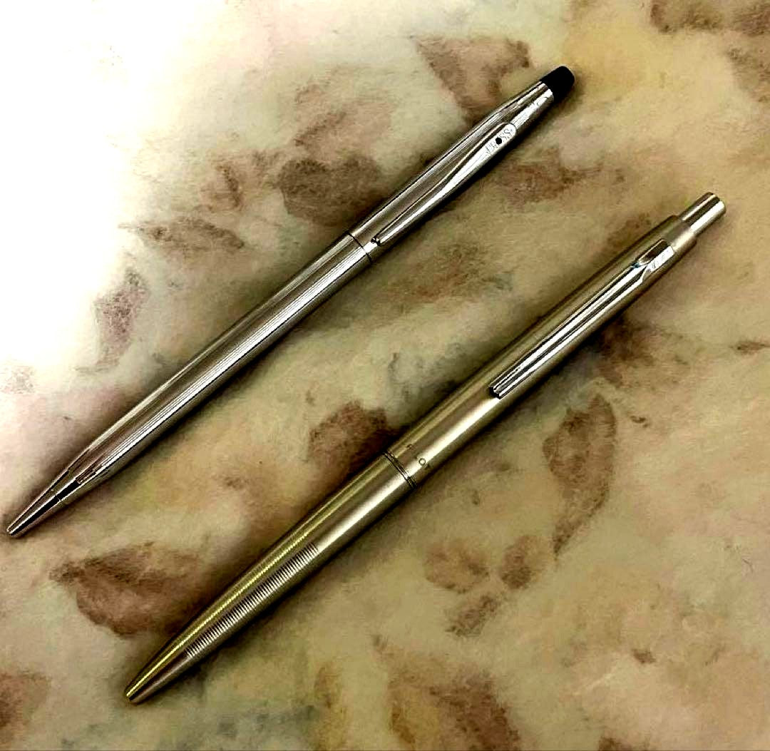 Set of two CROSS and PILOT ballpoint pens with minor scratches shown on the pen bodies