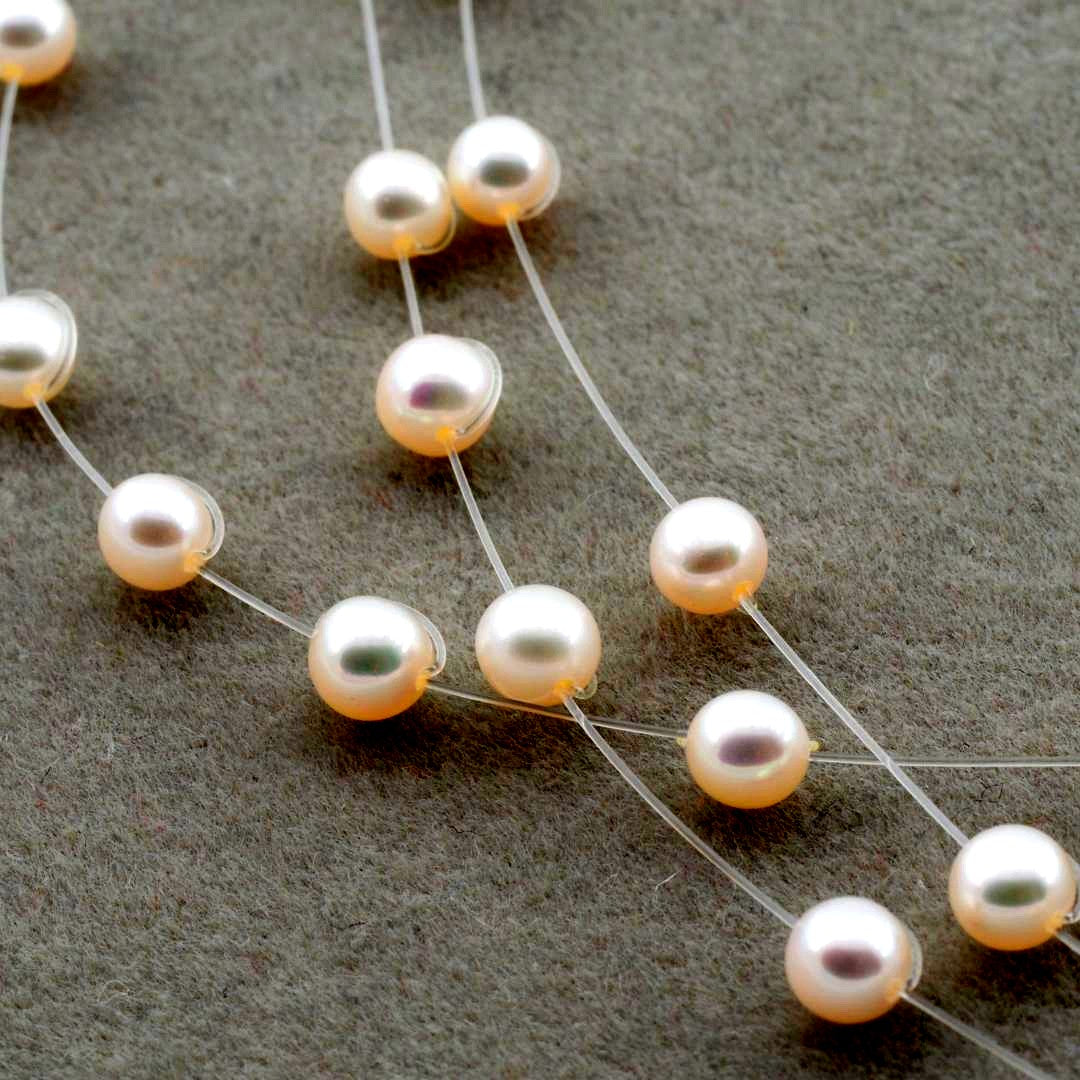 Tasaki pearl necklace with 4.0mm pearls on adjustable 39-43cm chain featuring wire box and warranty