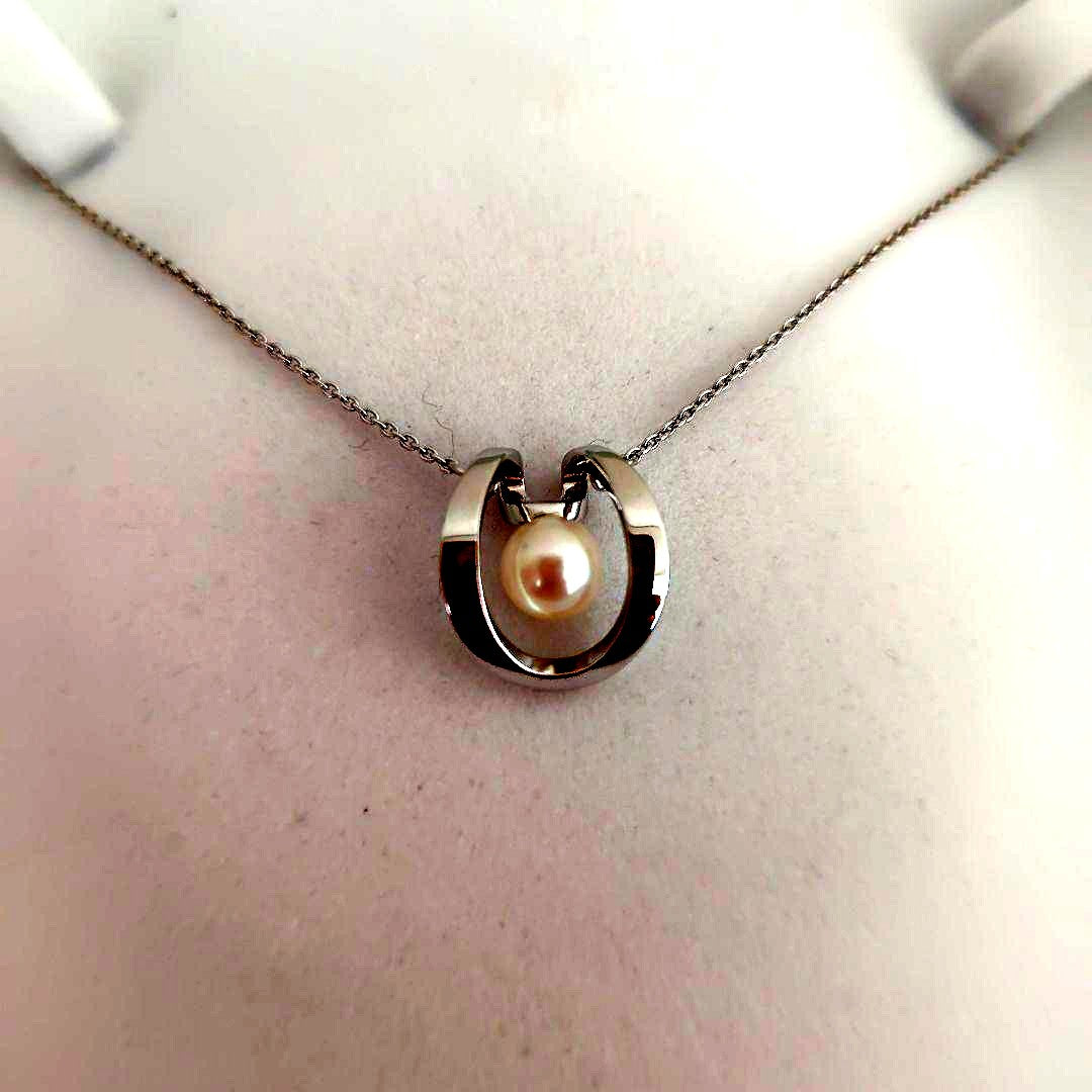 TASAKI silver pearl necklace measuring 43cm with delicate pearls and sleek silver chain