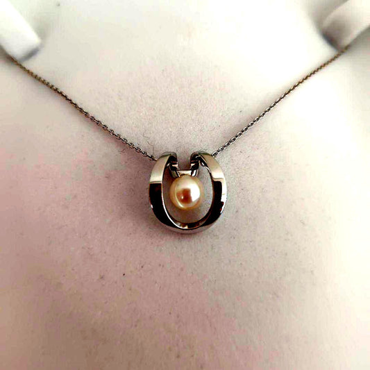 TASAKI silver pearl necklace measuring 43cm with delicate pearls and sleek silver chain