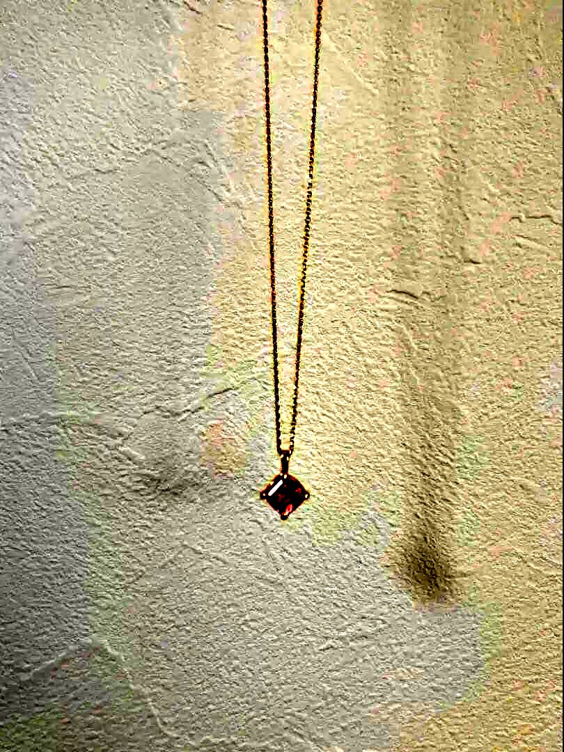 10K gold necklace with a pink agate diamond-shaped pendant measuring 9 mm stone and 13 mm top size