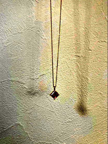 10K gold necklace with a pink agate diamond-shaped pendant measuring 9 mm stone and 13 mm top size