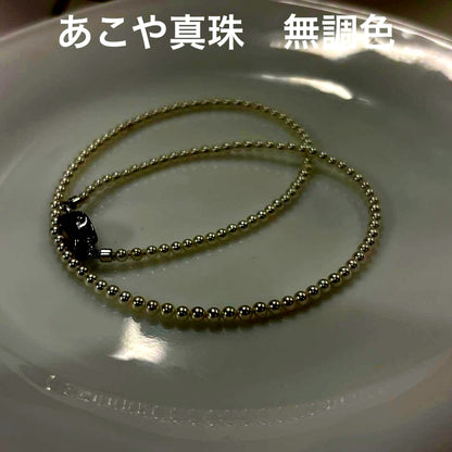Uncolored Akoya pearl necklace with 3-3.5mm baby pearls and 42cm length featuring a 925 clasp