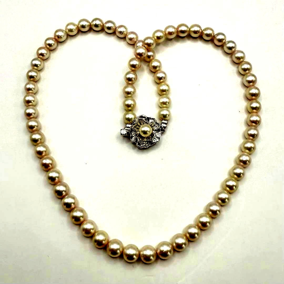 Yamato Akoya pearl necklace with 6mm pearls measuring 42cm displayed on a white background