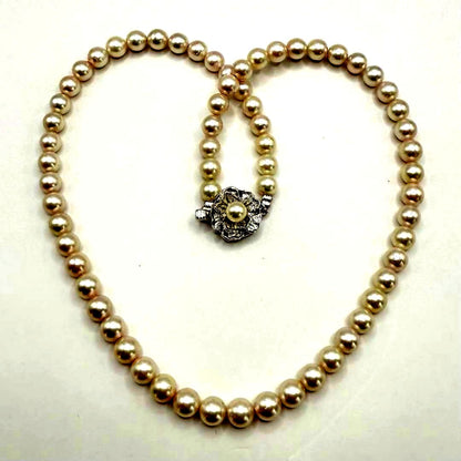 Yamato Akoya pearl necklace with 6mm pearls measuring 42cm displayed on a white background